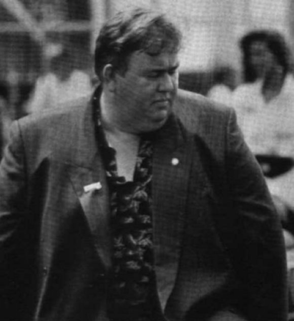 Just another day in John Candy's life, strolling down the street, under the gaze of the paparazzi.
