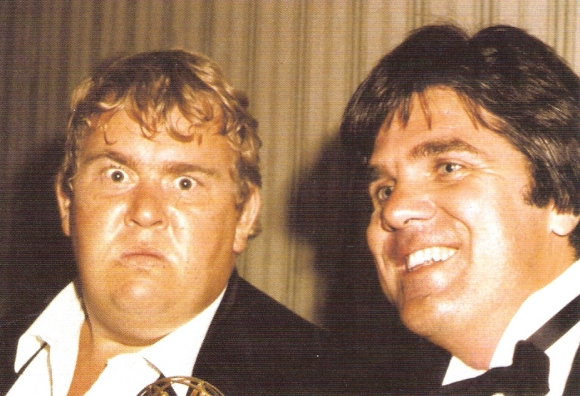 John Candy and Andrew Alexander enjoying their win at the Emmy Awards.